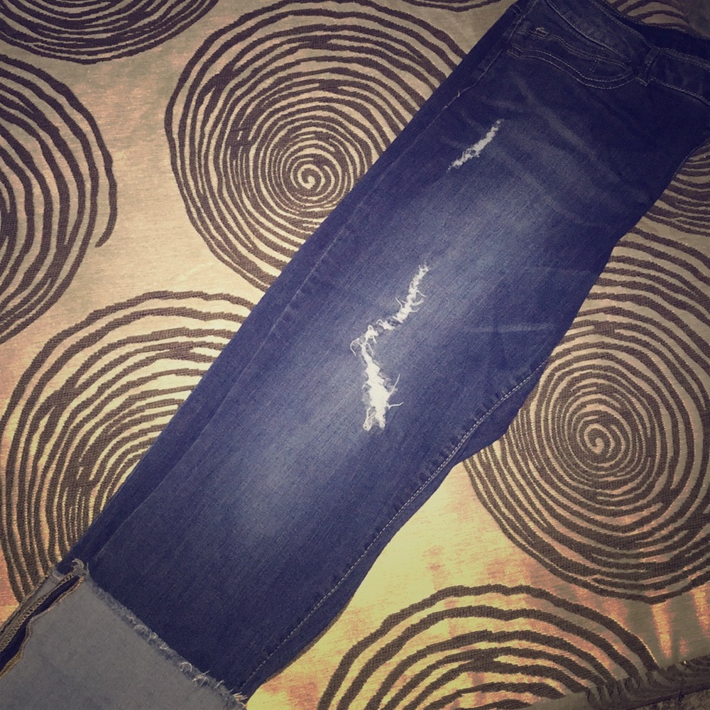 Dark blue distressed jeans